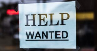 Help Wanted Sign in window