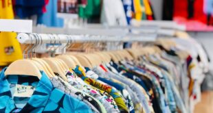 Shallow Focus Photo of Clothing Rack
