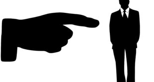 Black and white large hand pointing to black and white silhouette
